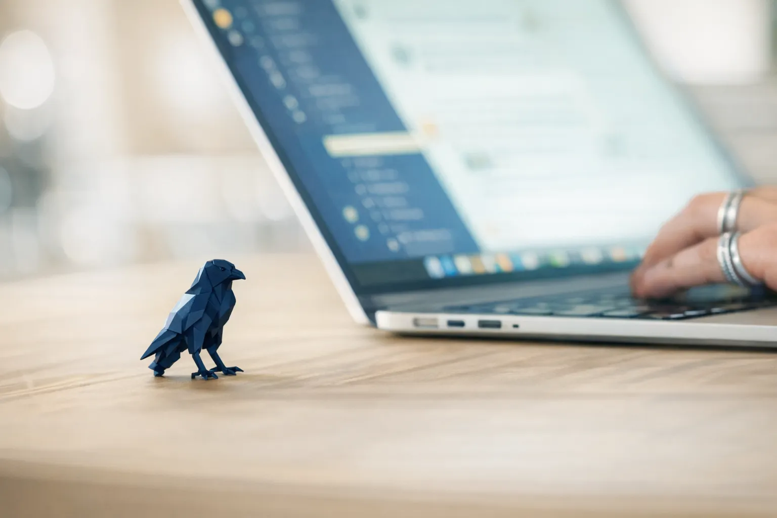 A falcon perched on a wooden post